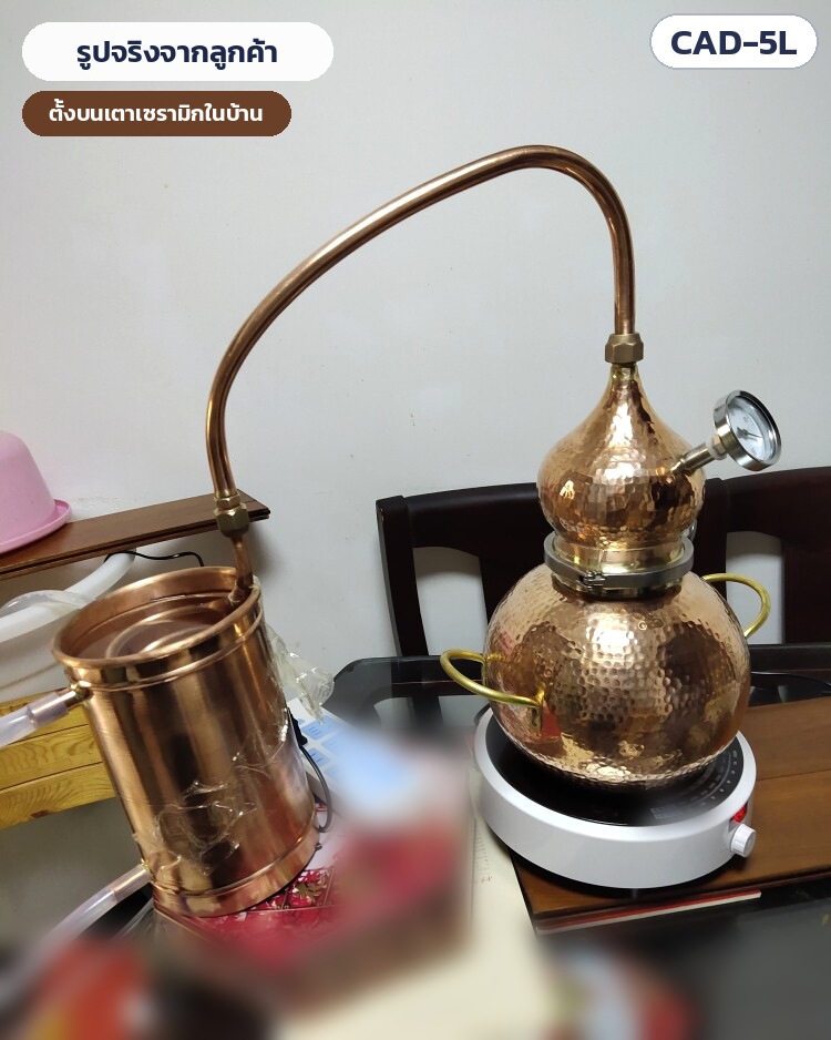 เครื่องกลั่นทองแดง Alembic 5 ลิตร รุ่น CAD-5L – รูปจริงจากลูกค้า เครื่องกลั่นทองแดง CAD-5L ตั้งบนเตาเซรามิกในบ้าน ต่อสายยางน้ำหล่อเย็นแล้ว
